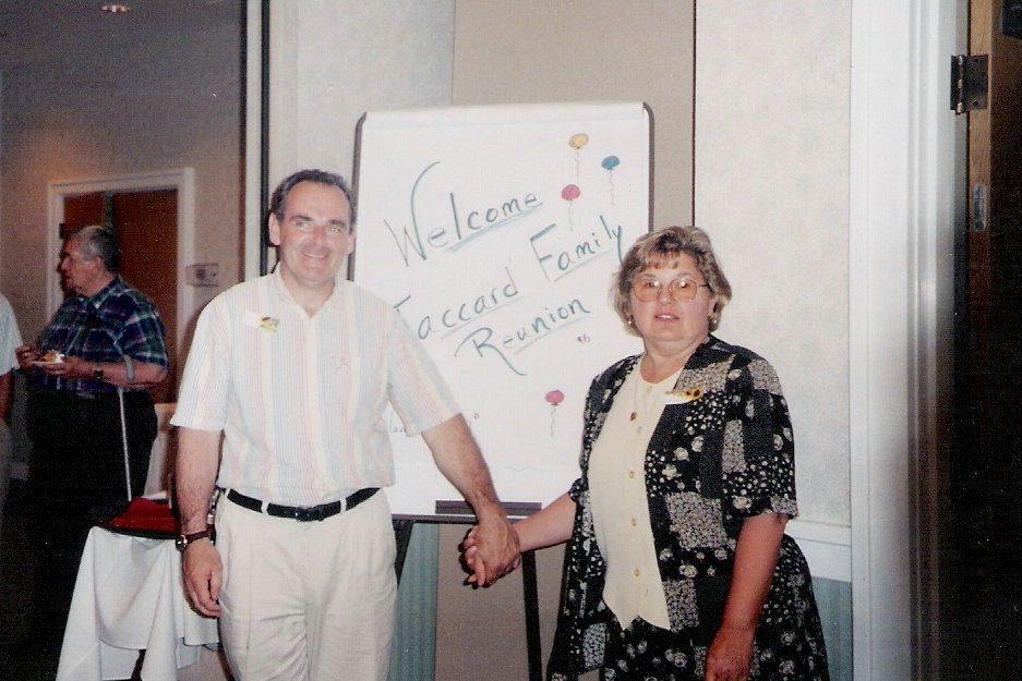 Tim and Aedan with family sign